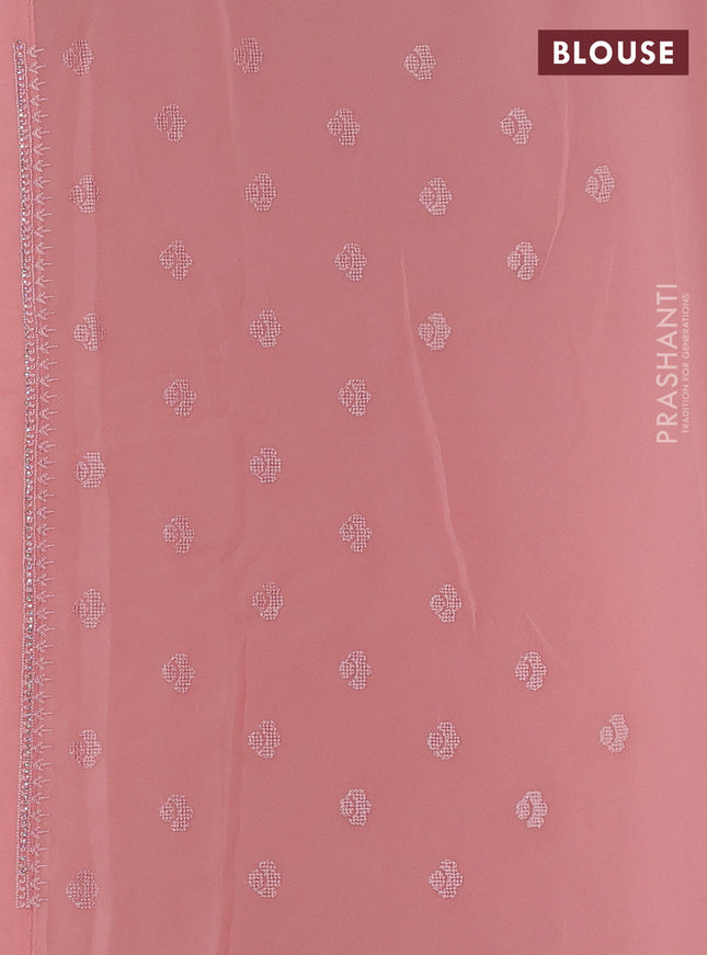 Georgette saree peach shade with allover embroidery work and embroidery border