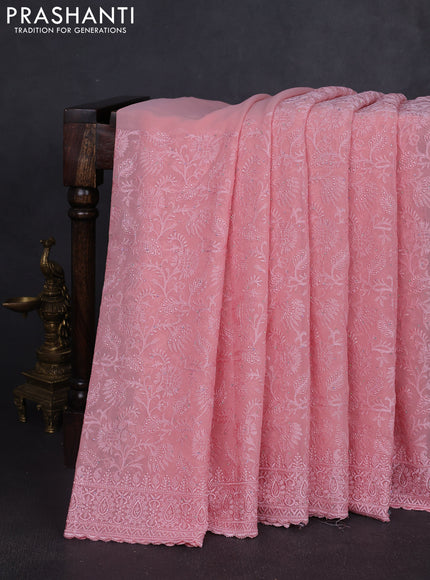 Georgette saree peach shade with allover embroidery work and embroidery border