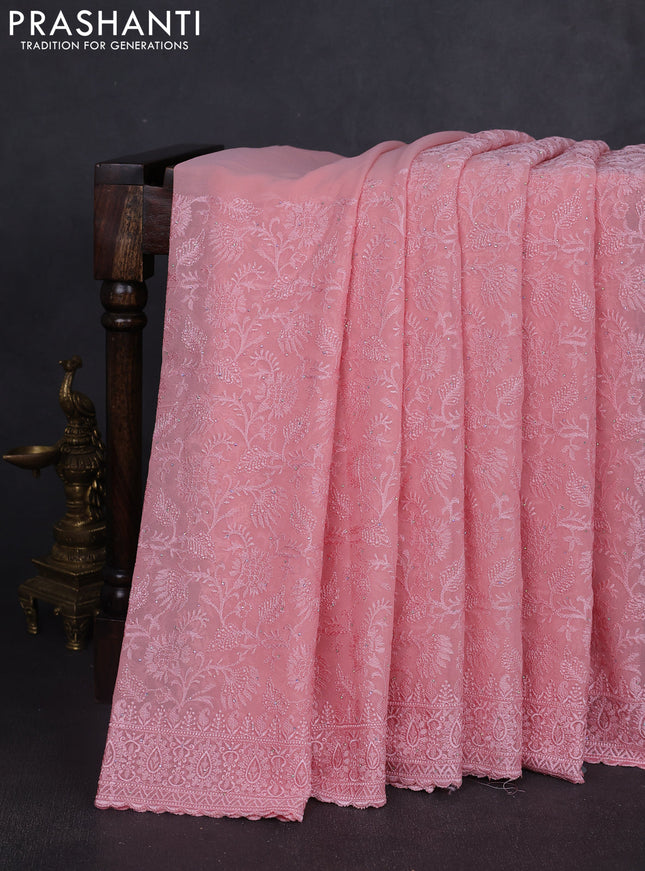 Georgette saree peach shade with allover embroidery work and embroidery border