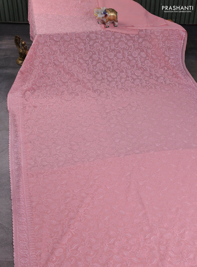 Georgette saree peach shade with allover embroidery work and embroidery border