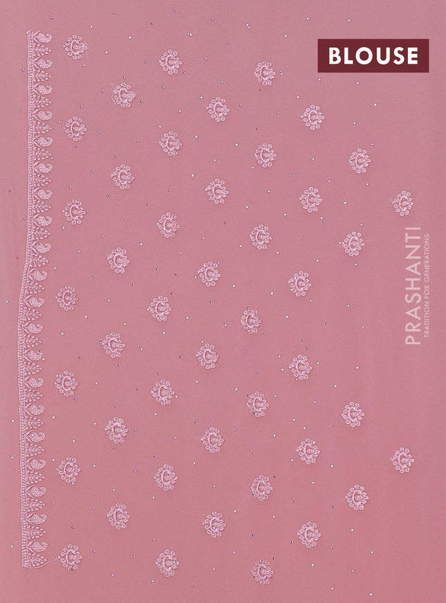 Georgette saree peach shade with allover embroidery work and embroidery border