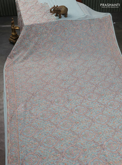 Georgette saree pastel green with allover embroidery stone work and stone work border