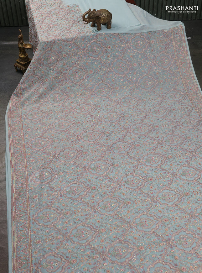 Georgette saree pastel green with allover embroidery stone work and stone work border