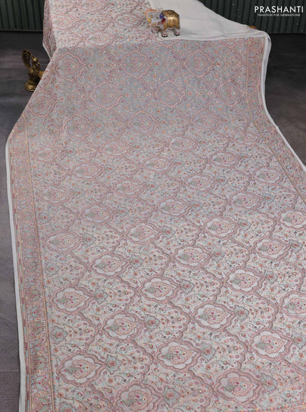 Georgette saree off white with allover embroidery stone work and stone work border