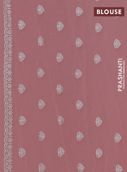 Georgette saree peach shade with allover embroidery work and embroidery border
