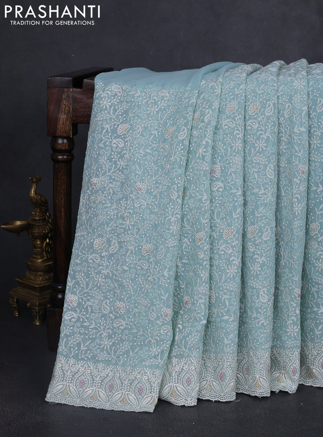 Georgette saree pastel blue with allover embroidery work and embroidery border