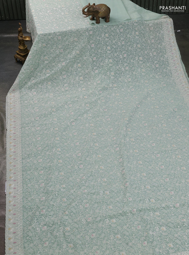 Georgette saree pastel green with allover embroidery work and embroidery border
