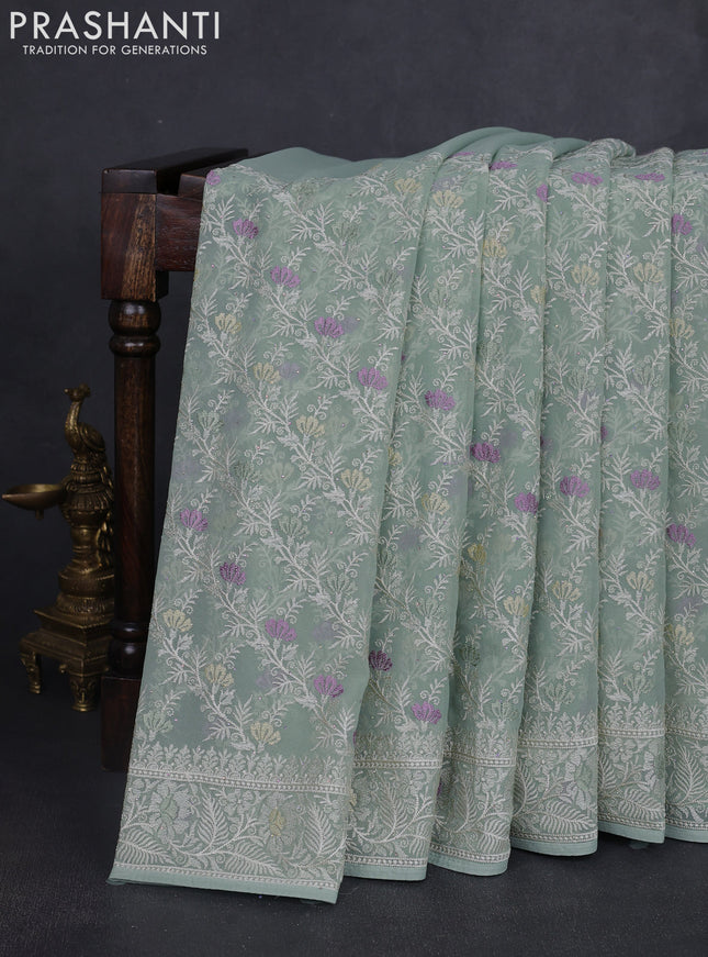 Georgette saree pastel green with allover embroidery work and embroidery border