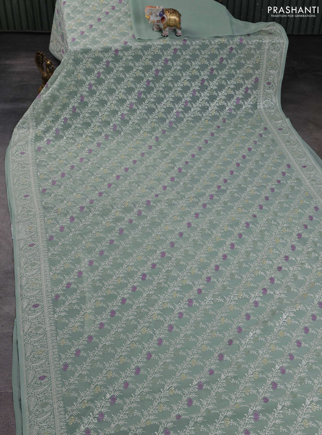 Georgette saree pastel green with allover embroidery work and embroidery border