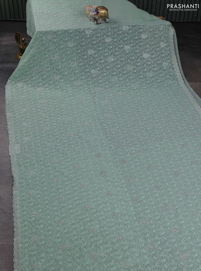 Georgette saree pastel green with allover embroidery stone work and stone work border