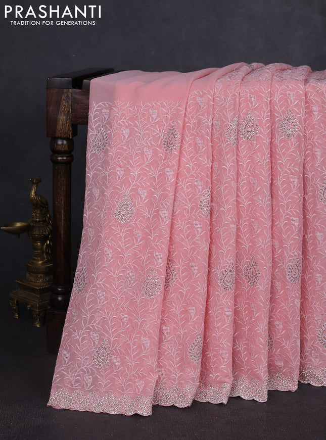 Georgette saree peach shade and  with allover embroidery stone work and stone work border