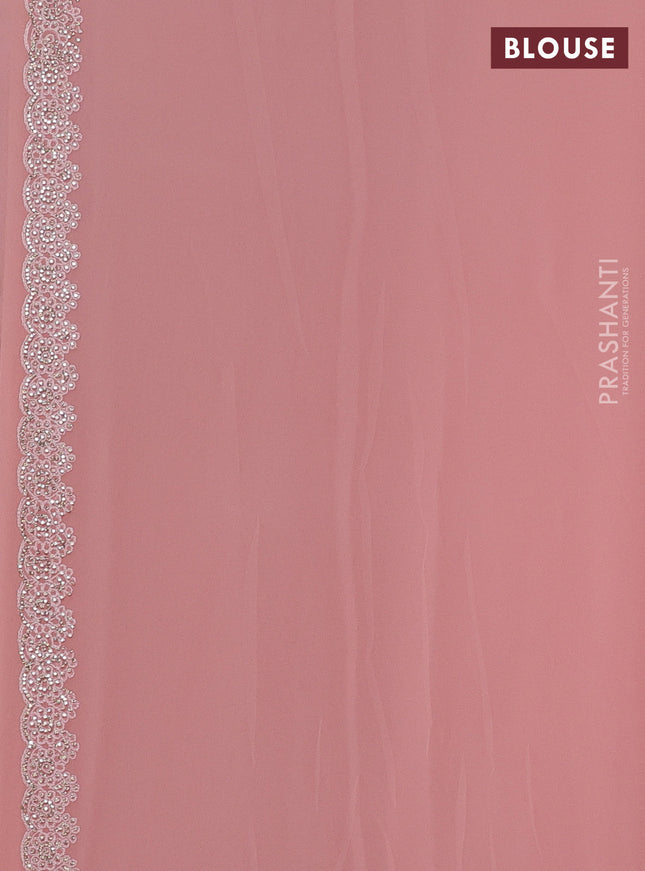 Georgette saree peach shade and  with allover embroidery stone work and stone work border
