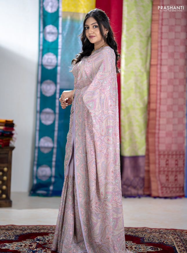 Georgette saree lavender with allover embroidery stone work and stone work border