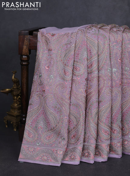 Georgette saree lavender with allover embroidery stone work and stone work border