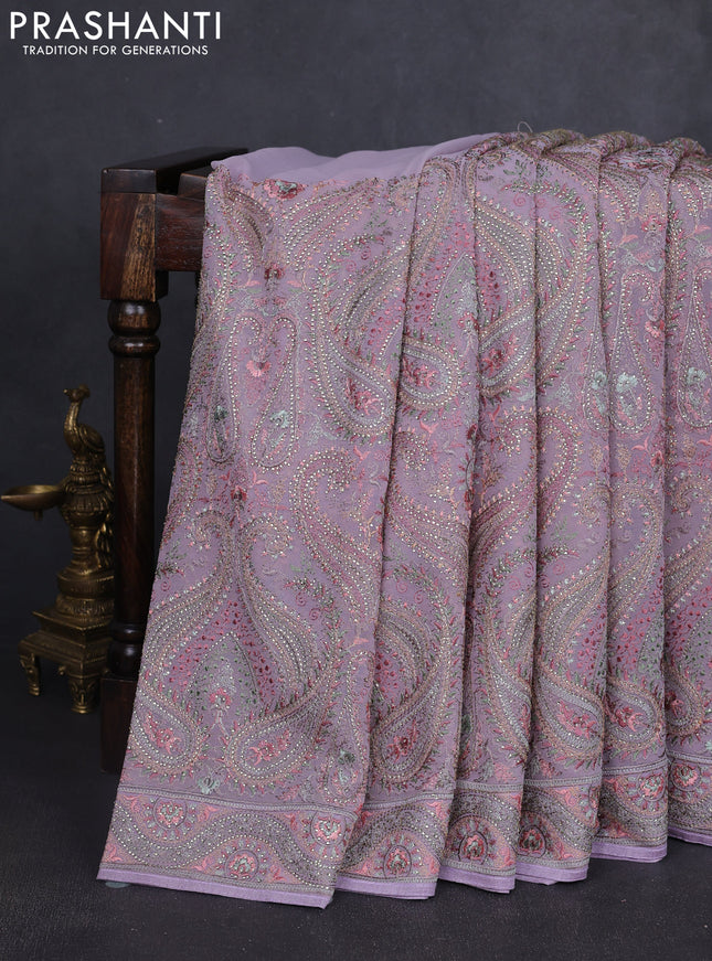 Georgette saree lavender with allover embroidery stone work and stone work border