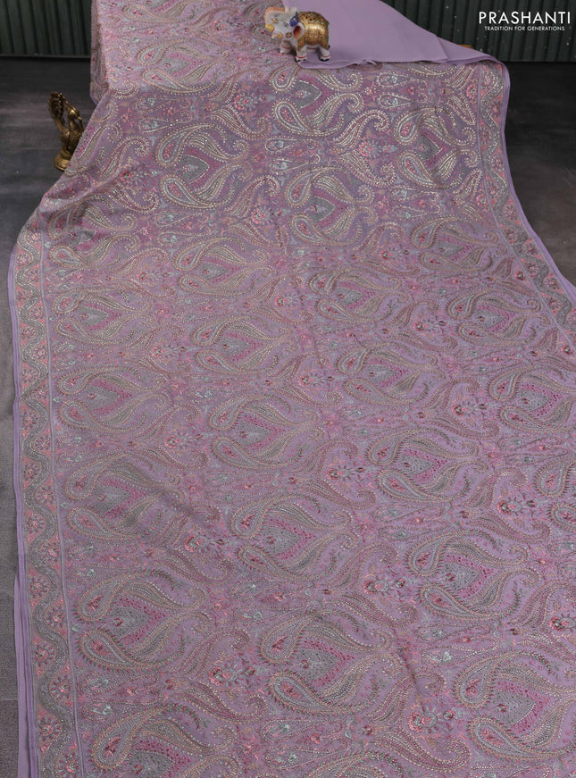 Georgette saree lavender with allover embroidery stone work and stone work border