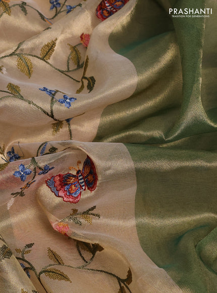 Tissue silk saree beige and green with allover embroidery work and long simple border