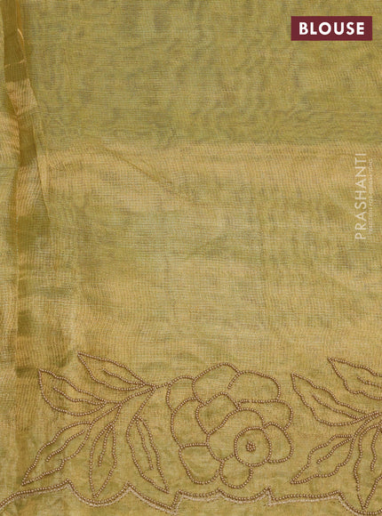Tissue silk saree elachi green with beaded work and beaded work embroidery border