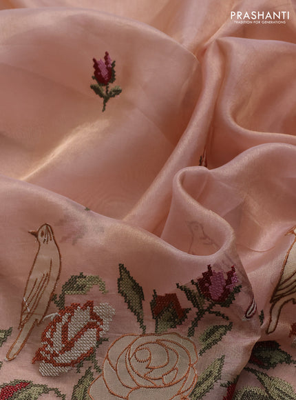 Tissue silk saree pale orange with embroidery buttas and kutch embroidery border