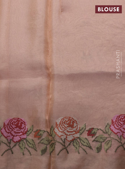Tissue silk saree pale orange with embroidery buttas and kutch embroidery border