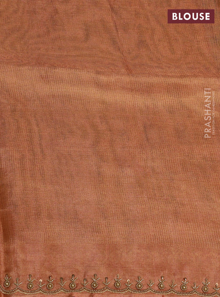 Tissue silk saree rust shade with beaded work and beaded work embroidery border