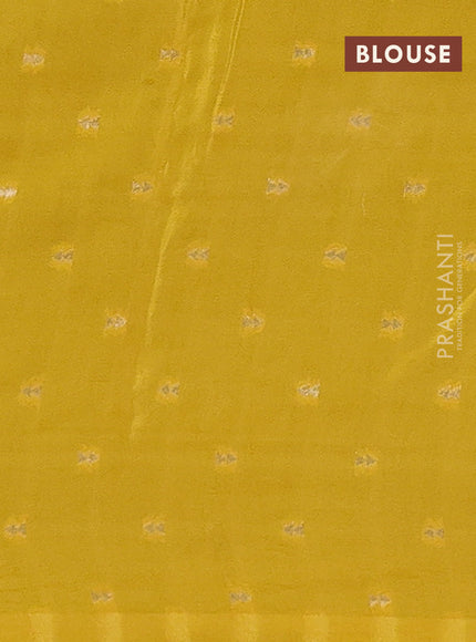 Semi mysore silk saree dark peacock green and yellow with palin body and long zari woven brocade border