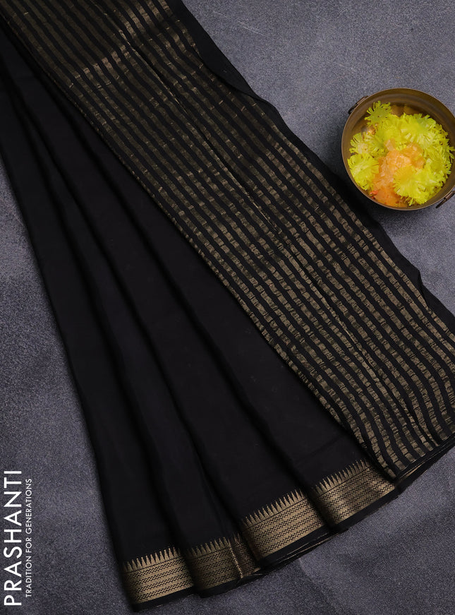 Semi mysore silk saree black and orange with palin body and zari woven border