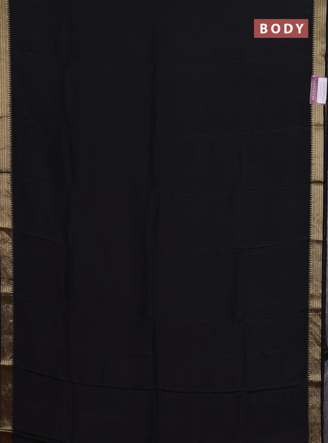 Semi mysore silk saree black and orange with palin body and zari woven border