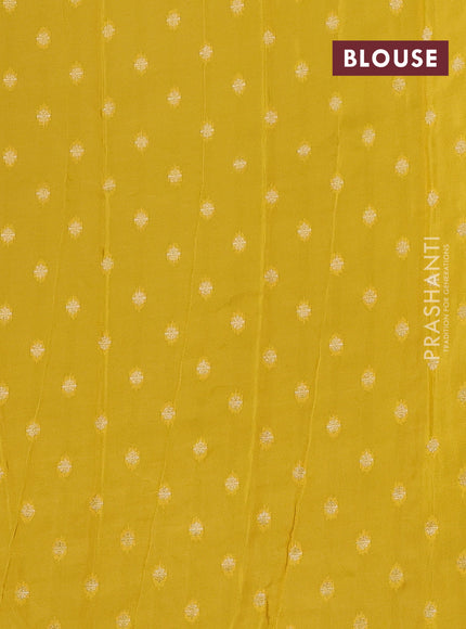 Semi mysore silk saree black and yellow with plain body and zari woven border