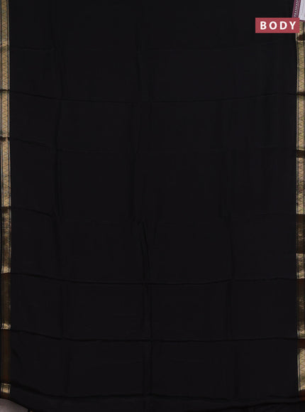 Semi mysore silk saree black and rustic orange with plain body and zari woven border
