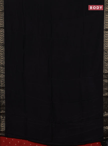 Semi mysore silk saree black and rustic orange with plain body an zari woven border