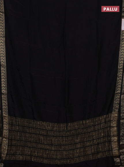 Semi mysore silk saree black and rustic orange with plain body an zari woven border