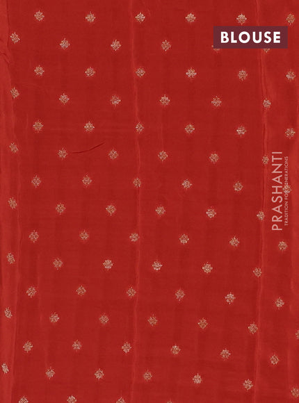 Semi mysore silk saree black and rustic orange with plain body an zari woven border
