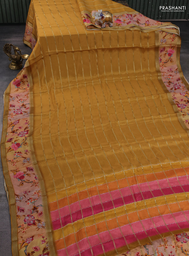 Art chiffon saree mustard yellow and pastel peach with allover zari stripe pattern and zari woven printed borded
