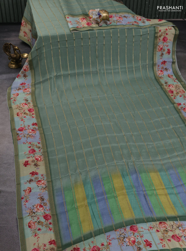 Art chiffon saree pastel green with allover zari stripe pattern and zari woven printed borded