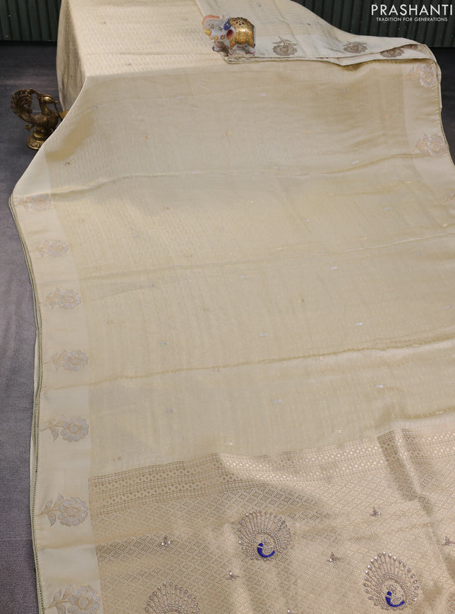 Banarasi silk saree cream with allover zari woven brocade weaves and embroidery pallu & zari woven butta border