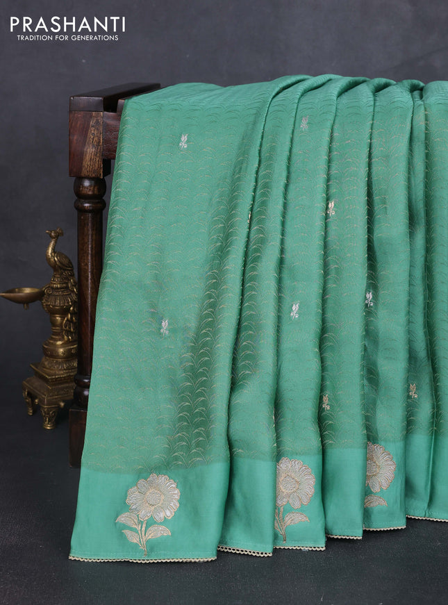 Banarasi silk saree teal green shade with allover zari woven brocade weaves and embroidery pallu & zari woven butta border
