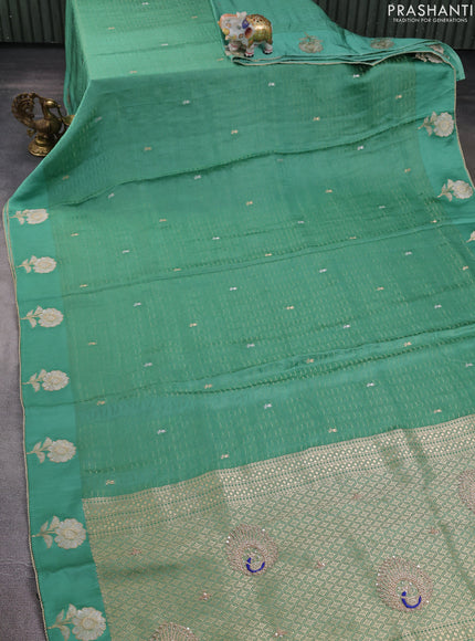 Banarasi silk saree teal green shade with allover zari woven brocade weaves and embroidery pallu & zari woven butta border