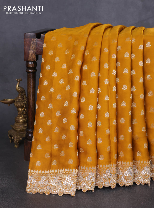 Banarasi silk saree dark mustard with allover zari woven buttas and mirror work embroidery border
