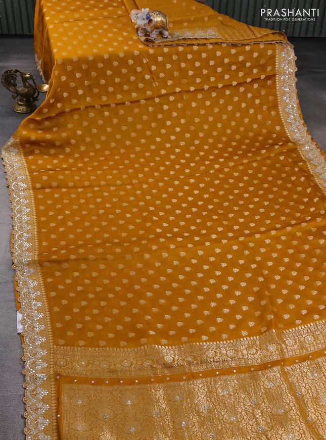 Banarasi silk saree dark mustard with allover zari woven buttas and mirror work embroidery border