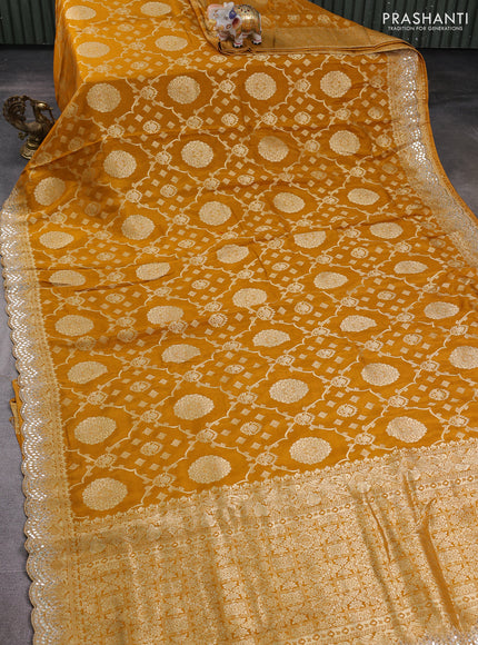 Banarasi silk saree dark mustard with allover zari weaves and mirror gotapatti embroidery border