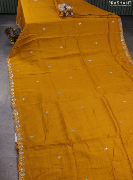 Banarasi silk saree dark mustard with mirror embroidery buttas and mirror embroidery border