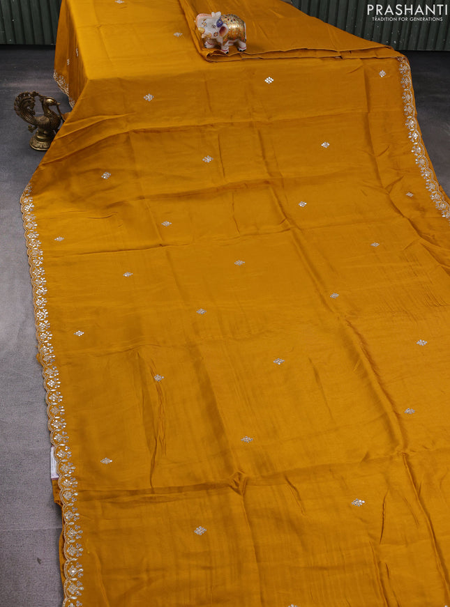 Banarasi silk saree dark mustard with mirror embroidery buttas and mirror embroidery border