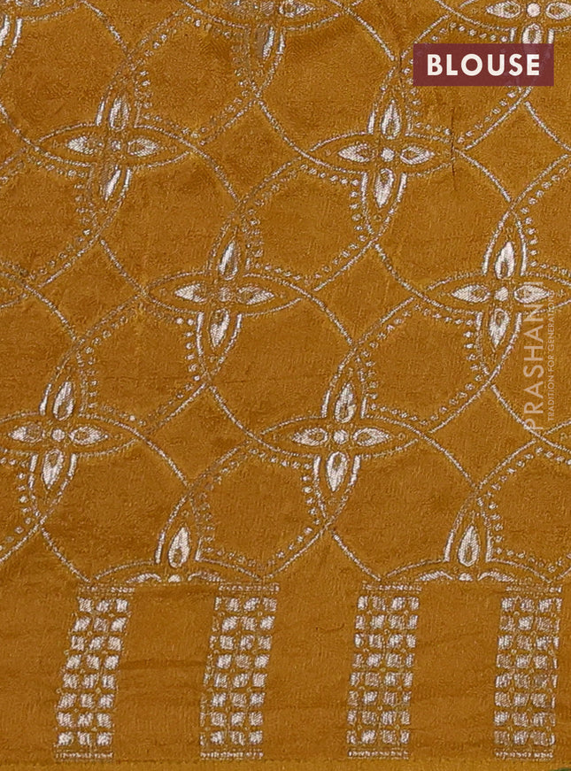Banarasi silk saree dark mustard with mirror embroidery buttas and mirror embroidery border
