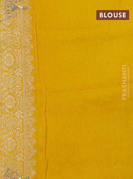 Banarasi silk saree yellow with allover woven buttas and mirror & beaded work embroidery border