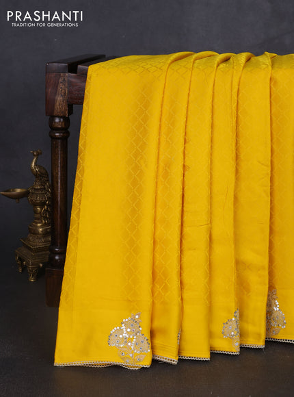 Banarasi silk saree yellow with allover self emboss and mirror work embroidery pallu