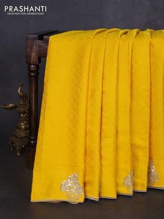 Banarasi silk saree yellow with allover self emboss and mirror work embroidery pallu