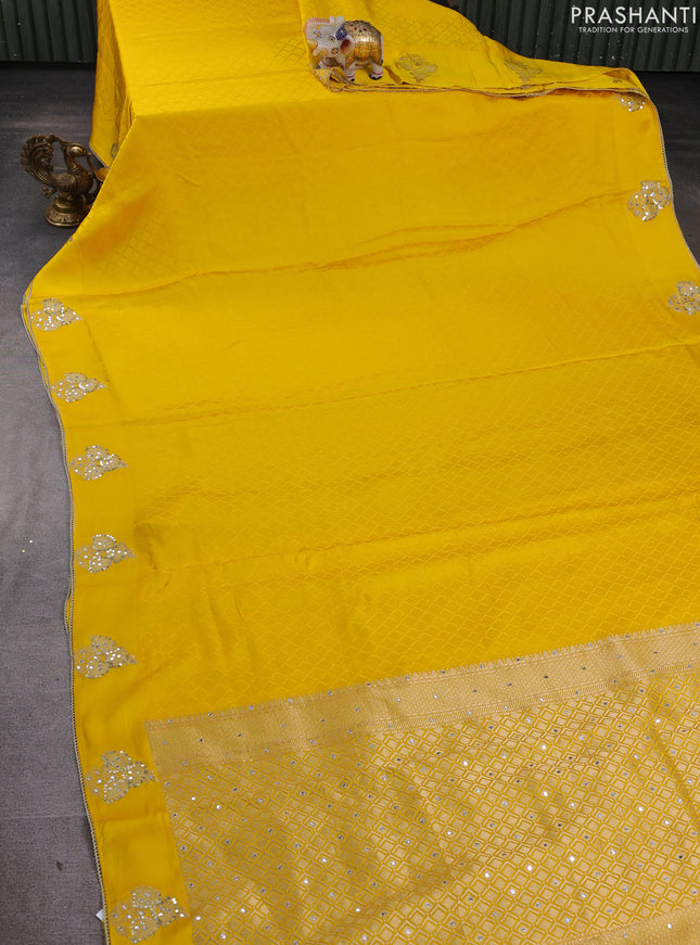 Banarasi silk saree yellow with allover self emboss and mirror work embroidery pallu
