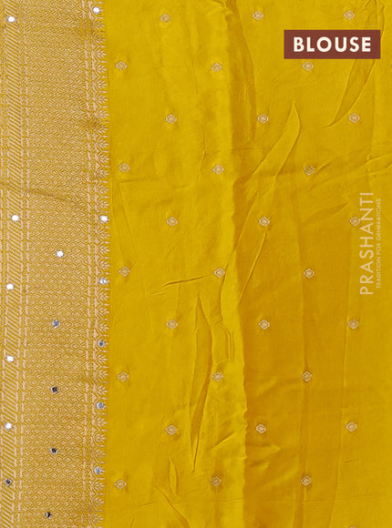 Banarasi silk saree yellow with allover self emboss and mirror work embroidery pallu