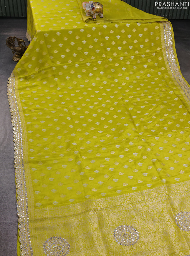 Banarasi silk saree lime green with allover silver & gold zari woven buttas and mirror work embroidery border